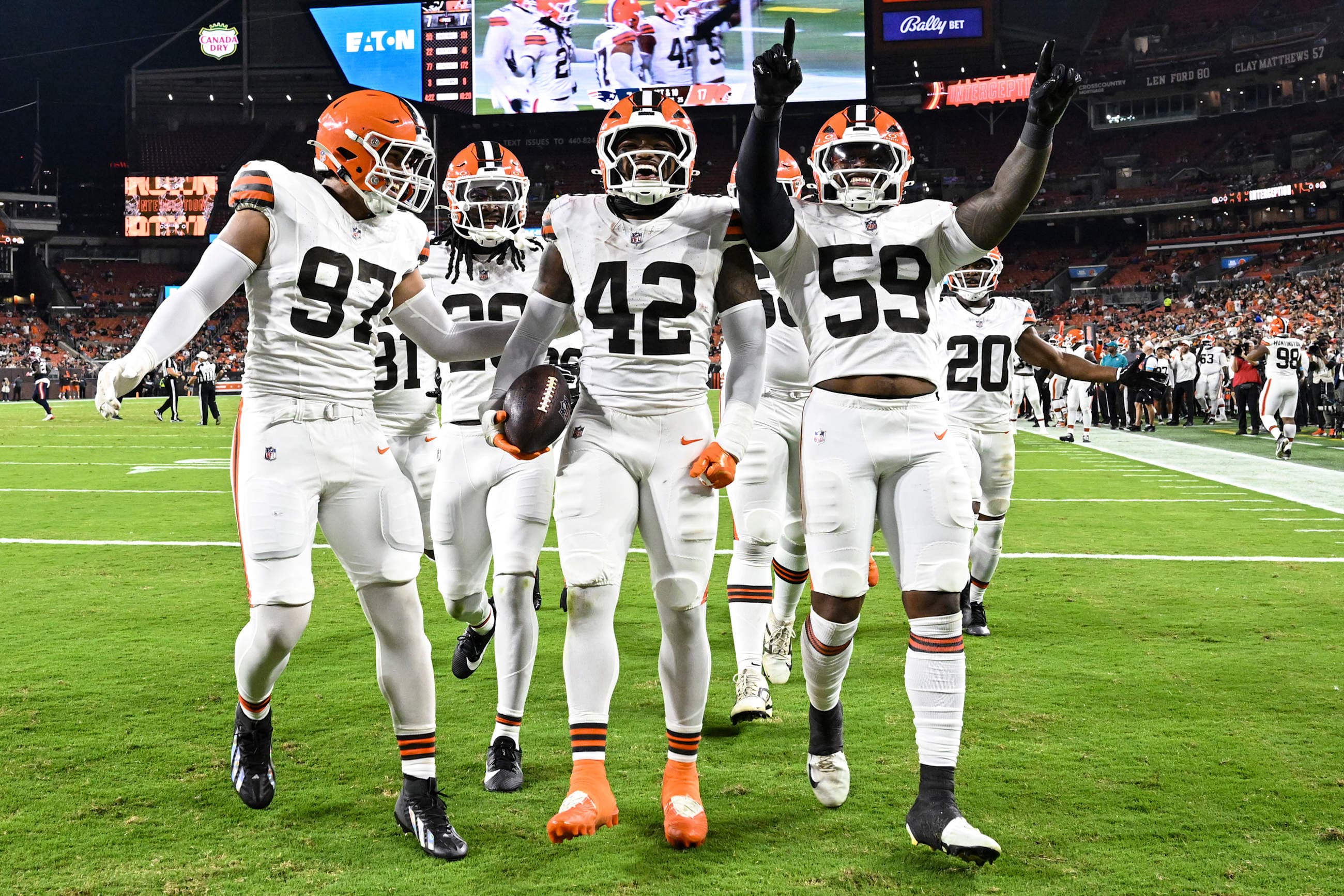 Defensive end Logan Fano (97), Linebacker Easton Mascarenas Arnold (42), and Linebacker Winston Reid (59) during a preseason NFL football game between the New England Patriots and Cleveland Browns on August 27, 2026 at Huntington Bank Field.